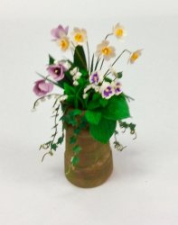 Daffodils, Pansies, Tulips, and Lilies of the Valley in Clay Pot