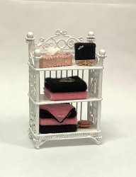 White Bathroom Shelves with Pink & Black Towels & Accessories
